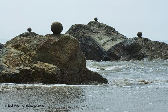Noon, Stinson Beach, California. Sand globes on rocks. I know the tide will take them away. 2006.