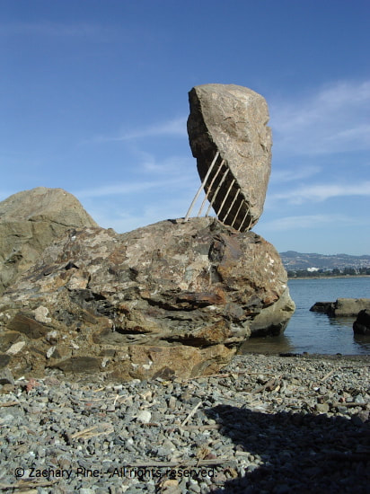 Afternoon, Berkeley Marina, Berkeley, California. Rock and sticks. What seems to need support doesn't need support, and what seems to give support doesn't give any. 2003.